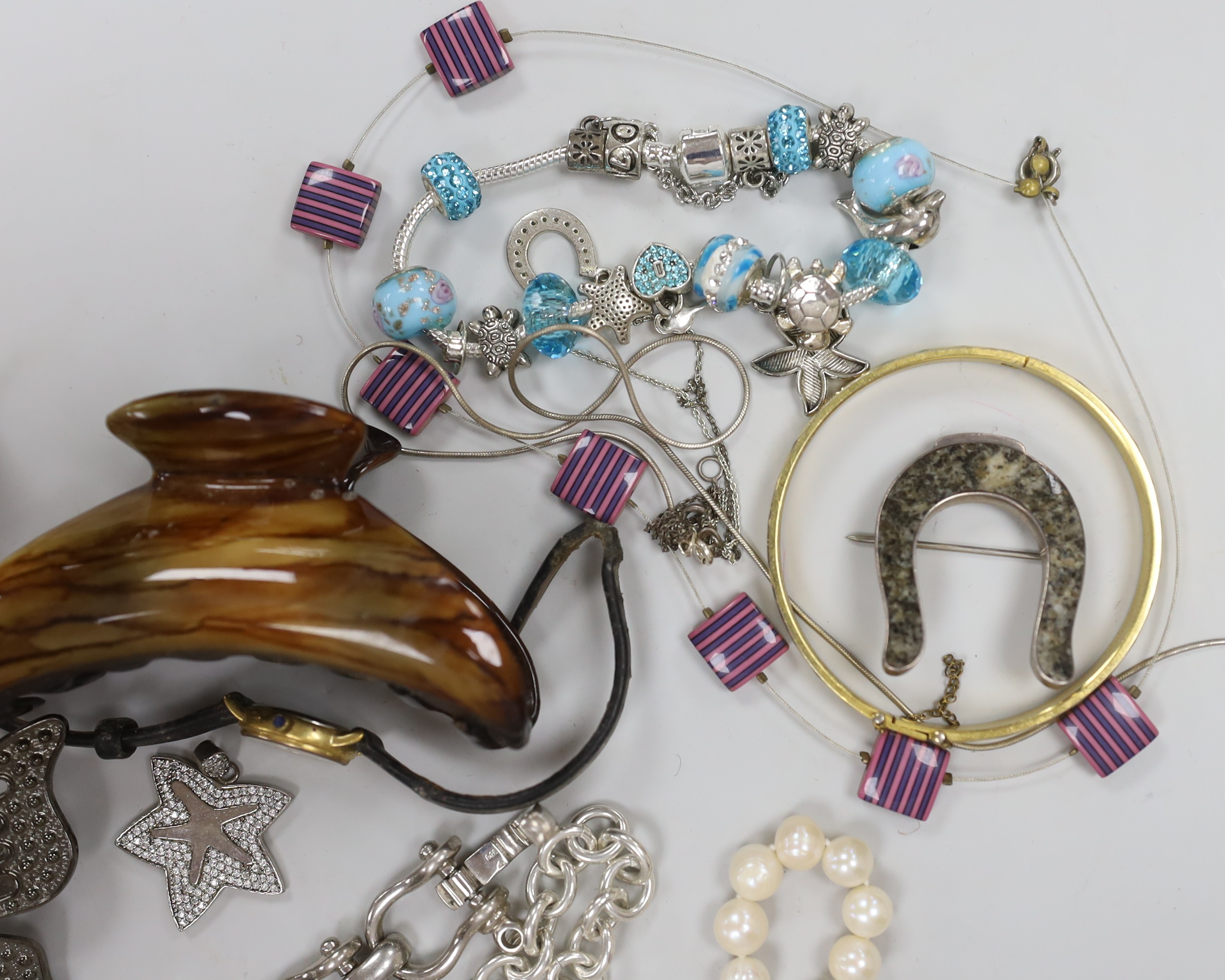 Four assorted 9ct gold and gem set rings, gross weight 6.3 grams, a 925 and rose quartz bracelet, a silver bracelet watch, a silver horseshoe and riding crop brooch and other jewellery including costume.